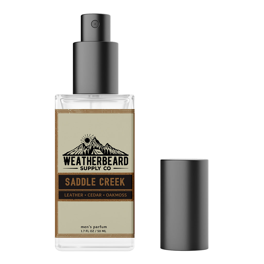 Saddle Creek 50ML Spray Parfum bottle with leather, cedarwood, and oakmoss notes, capturing the bold essence of rugged masculinity and adventure.